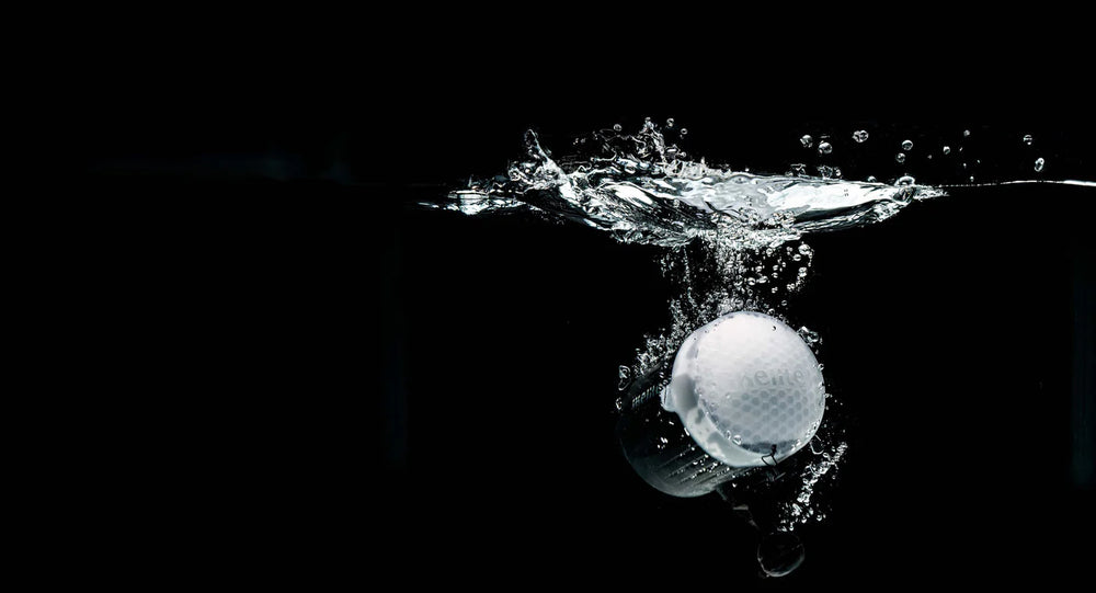 Strobe splashing into water on a black background